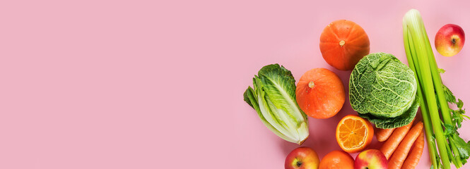 Assortment of vegetables and fruits on colorful background.