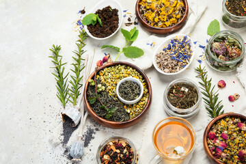 Herbal tea assortment on dark background.
