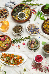 Herbal tea assortment on dark background.