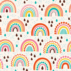 Vector seamless pattern with colored rainbows and raindrops. Bright repeated texture with hand drawn abstract doodle. Scandinavian pattern for kids clothing and wallpaper. Geometric ornament