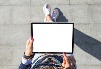 Fototapeta Woman using tablet computer with blank white screen, view from above obraz