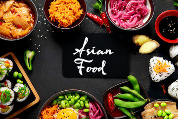 Assortment of Korean food on dark background.