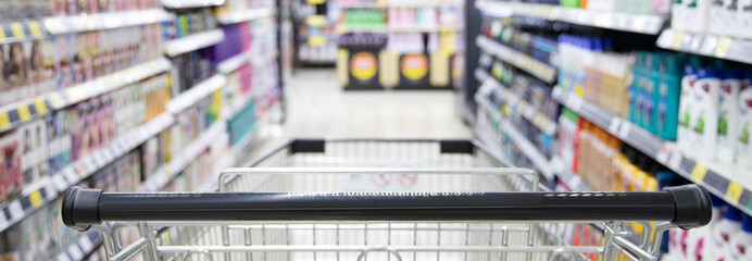 Shopping cart in supermarket, Abstract blurred photo in shopping malls, Cart in the market, wide...