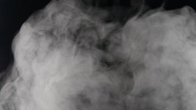 Transparent smoke clouds, abstract fog, white steam texture on black background