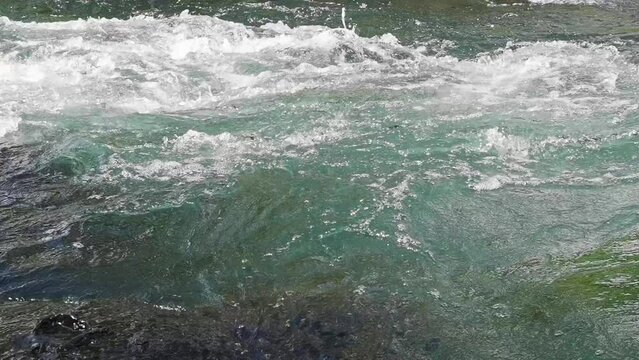 Steady shot of stream of water. Sport rafting on rivers. Beautiful view of flowing river water