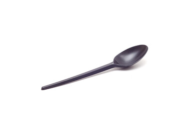 one black plastic spoon isolated on white background.