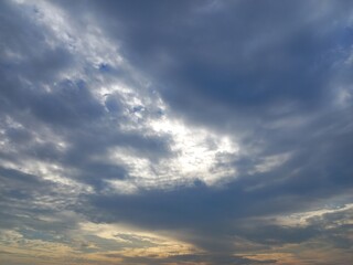 blue sky with sunlight behind the cloud of stratocumulus cloud