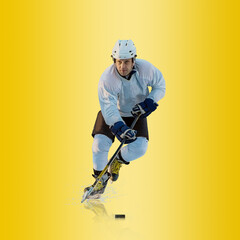 Professional ice hockey player hitting puck for winning goal in action on gradient multicolored...