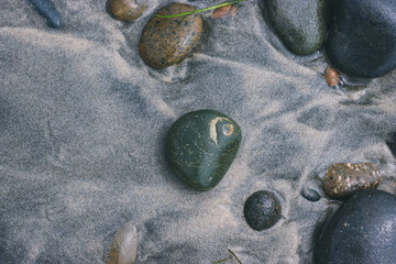 stones on the beach, swirl design in the stone