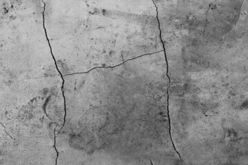 Obraz premium Close-up of an abstract gray concrete texture background with cracks and bumps.