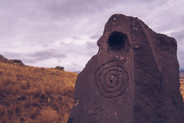 Megalithic standing stones with petroghliphs, burial mound of Zorats Karer or Carahunge -...