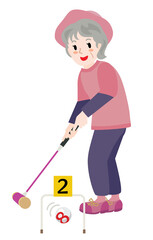 ゲートボールをするシニア女性