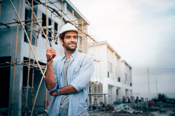 Engineers or leader discussion and pointing to construction site project on workplace. Teamwork, Leadership concept.