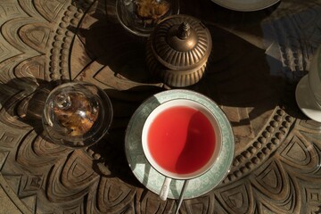Cup of hibiscus tea on the table