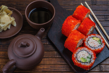 Fototapeta na wymiar Asian traditional snack. Japanese sushi - fast food