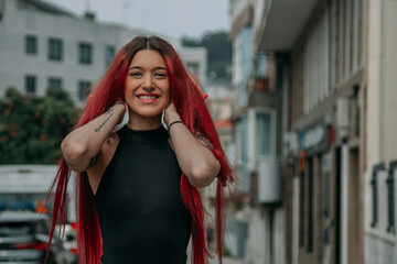 portrait of happy red-haired woman on the street