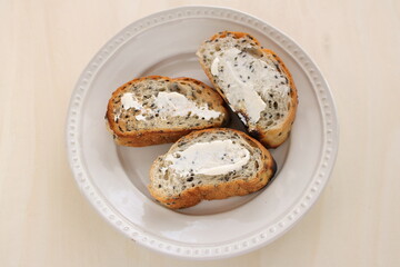 Sliced sesame French bread with cream cheese