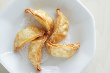 Chinese dumpling, deep fried, jiaozi on plate for yum cha food image