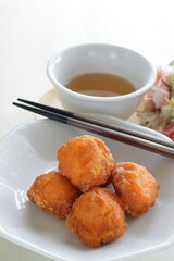 Chinese sweet dim sum food, deep fried ball on white dish