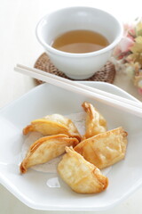 Chinese dumpling, deep fried, jiaozi on plate for yum cha food image