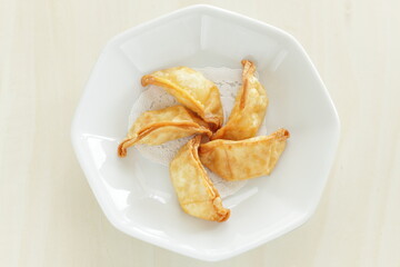 Chinese dumpling, deep fried, jiaozi on plate for yum cha food image