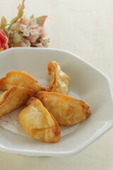 Chinese dumpling, deep fried, jiaozi on plate for yum cha food image