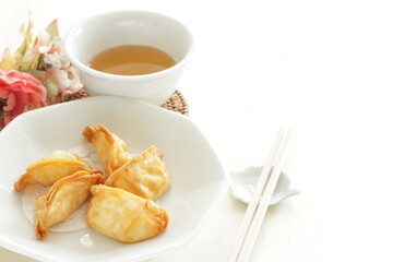 Chinese dumpling, deep fried, jiaozi on plate for yum cha food image