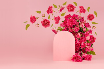 Spring abstract stage - arch of pink fresh spray roses, blank rounded space as podium mockup with...