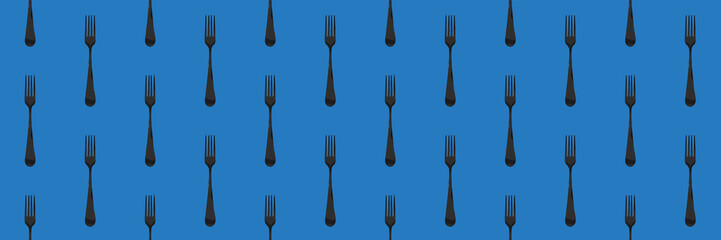 Seamless pattern. Fork top view on blue blue background. Template for applying to surface. Banner for insertion into site. Flat lay. 3D image. 3D rendering.