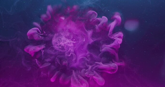 Ink color blend. Paint water drop. Transition reveal effect. Neon pink blue fluid splash on vibrant purple fume texture creative abstract background shot on Red Cinema camera 6k.