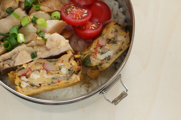 Homemade chicken and fried egg with rice lunch box for asian food image