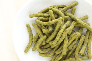 Japanese green tea Wagashi on dish for traditional crispy snack image