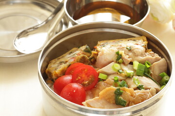 Homemade chicken and fried egg with rice lunch box for asian food image