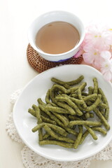 Japanese green tea Wagashi on dish for traditional crispy snack image