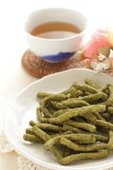 Japanese green tea Wagashi on dish for traditional crispy snack image