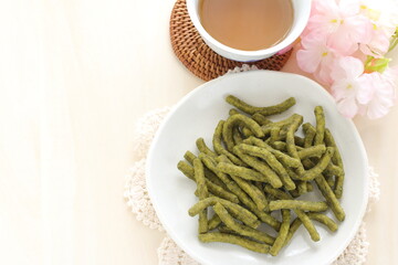Japanese green tea Wagashi on dish for traditional crispy snack image