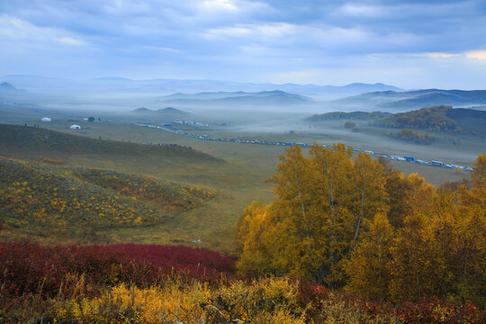 yellow leaves and remote mountains in Golden Autumn in Bashang Prairie