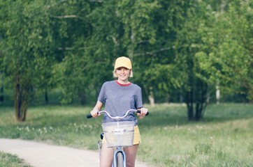 happy woman on a bike ride in the park, active people, outdoors