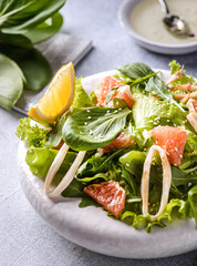 green salad with squid and grapefruit