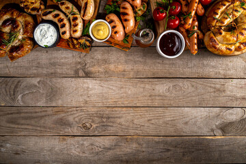 Mix bar-b-q sausages - bavarian, round, gumberland, bratwurst with ketchup, mustard barbeque sauce....