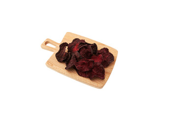 Dried beet slices. Dehydrated, dried beetroot chips on wooden board. Healthy vegan snacks. Selective focus, copy space