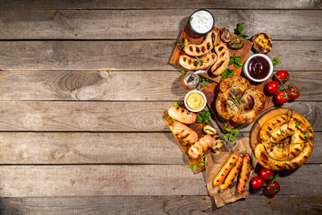 Mix bar-b-q sausages - bavarian, round, gumberland, bratwurst with ketchup, mustard barbeque sauce....