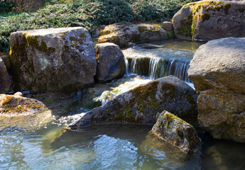 idyllic small Creek with waterfalls theme for rest and relaxation