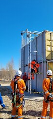 Delegates do practical exercises during a training session on working at height