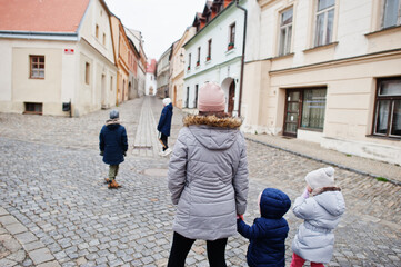 Fototapeta na wymiar Mother with kids walking old town Znojmo in the South Moravian Region of the Czech Republic.