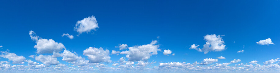 Fototapeta premium Blue Sky background with tiny Clouds. Panorama background