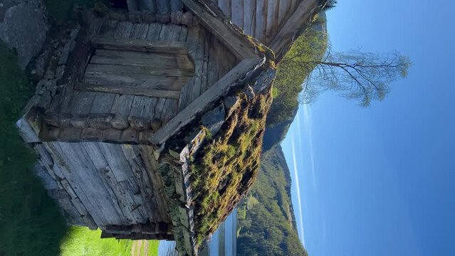 Sunnfjord open-air museum is the cluster of antiquarian buildings in authentic cultural landscape that transported here from various places in the district of Sunnfjord, Norway. Vertical video.