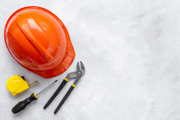 Engineer safety helmet with construction tools, top view
