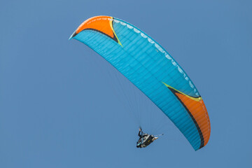 Twin paraglider. Paragliding against the blue sky.