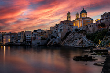 The beautiful Vaporia district of Ermoupoli town on Syros island, Cyclades, Greece, during a colorful dusk